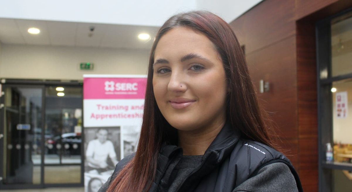 Young woman smiling into the camera.